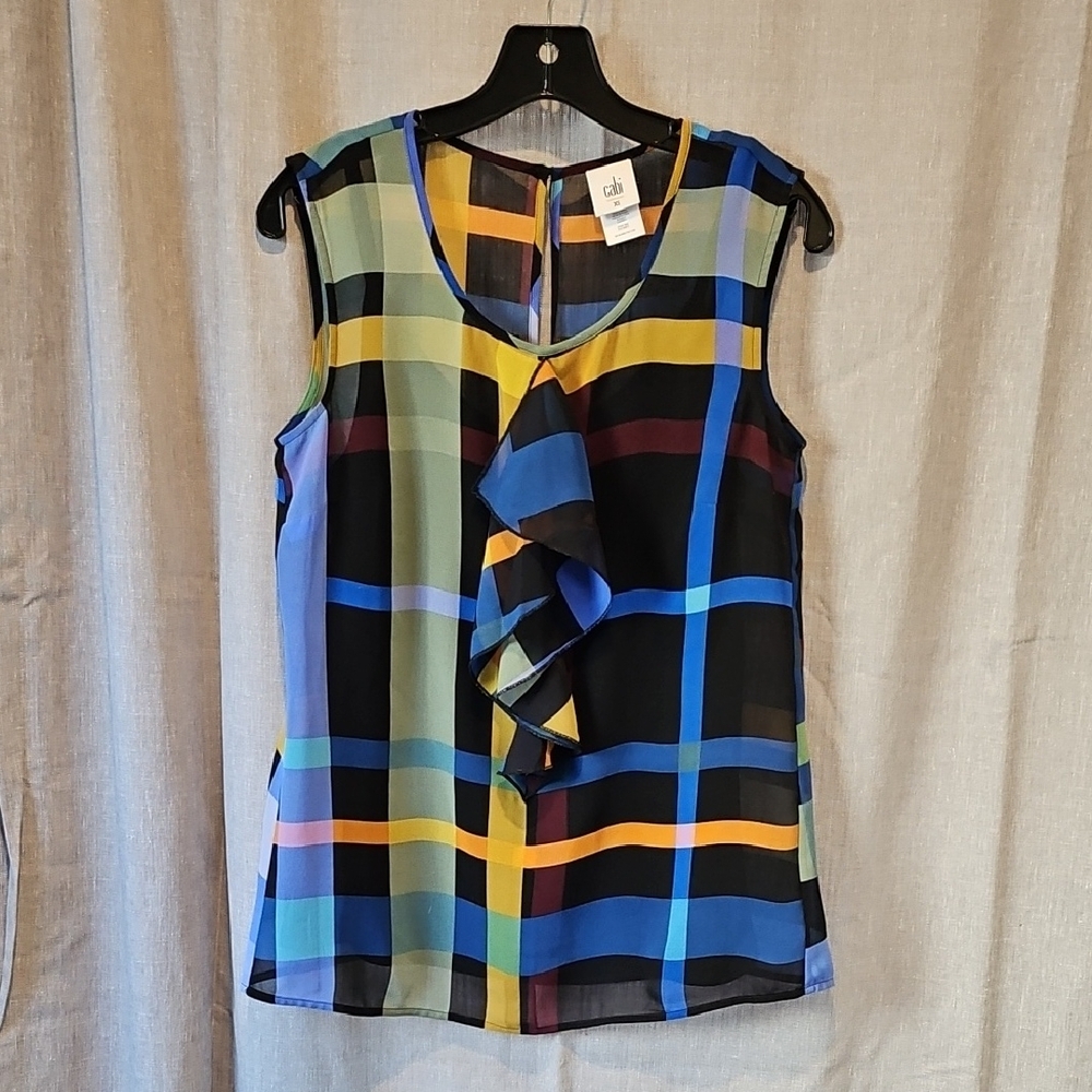 CAbi Blue Black Multicolor Ruffled Sleeveless Blouse Over Black Tank Top